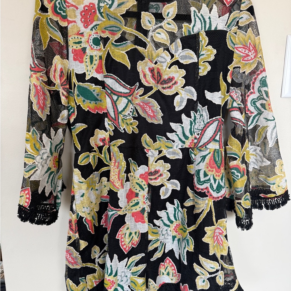 Chic Entro black and floral romper with mesh sleeves and neckline